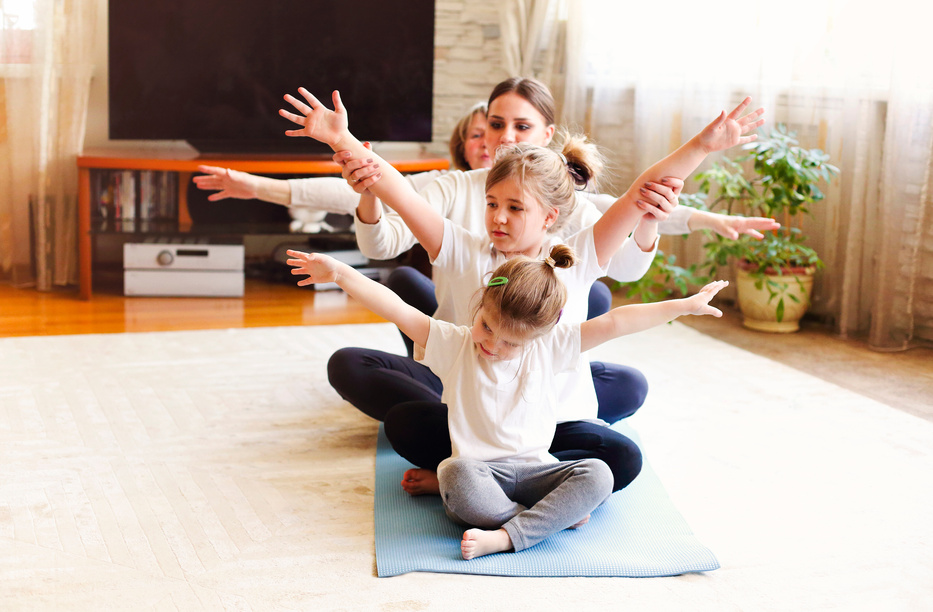 Multi Generational Family Doing Yoga Together